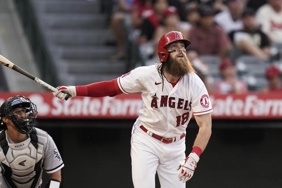 Brandon Marsh watches his triple against the Chicago White Sox.