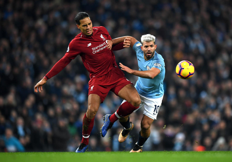 MANCHESTER, ENGLAND - JANUARY 03:  Sergio Aguero of Manchester City is fouled by Virgil van Dijk of Liverpool during the Premier League match between Manchester City and Liverpool FC at the Etihad Stadium on January 3, 2019 in Manchester, United Kingdom.  (Photo by Shaun Botterill/Getty Images)