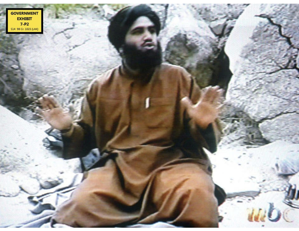 In this undated Photo taken from video and provided by the United States Attorney’s Office for the Southern District of New York, defendant Suliman Abu Ghayth, sits on the ground somewhere in Afghanistan. Abu Ghayth, is being tried in New York for plotting to kill Americans by being a motivational speaker at al-Qaida training camps before the Sept. 11 attacks and for serving as a spokesman for the terror group afterward. This photo was among the trial exhibits that the federal prosecutor showed the jury, sometimes repeatedly. (AP Photo/US Attorney’s Office for the Southern District of New York)