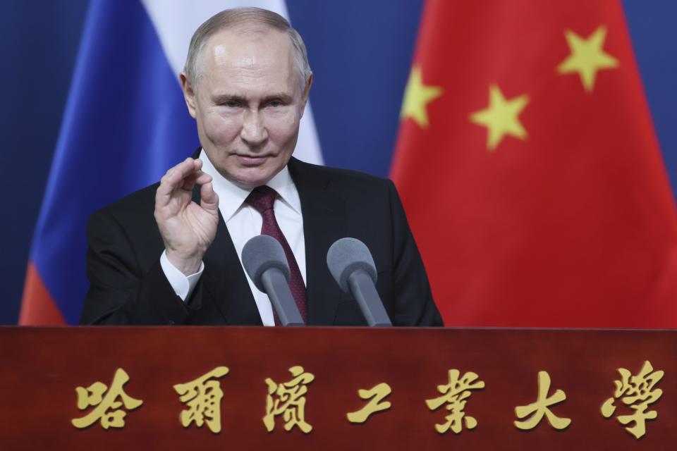 Russian President Vladimir Putin gestures as he talks with students of the Harbin Institute of Technology in Harbin, northeastern China's Heilongjiang Province, on Friday, May 17, 2024. (Mikhail Metzel, Sputnik, Kremlin Pool Photo via AP)