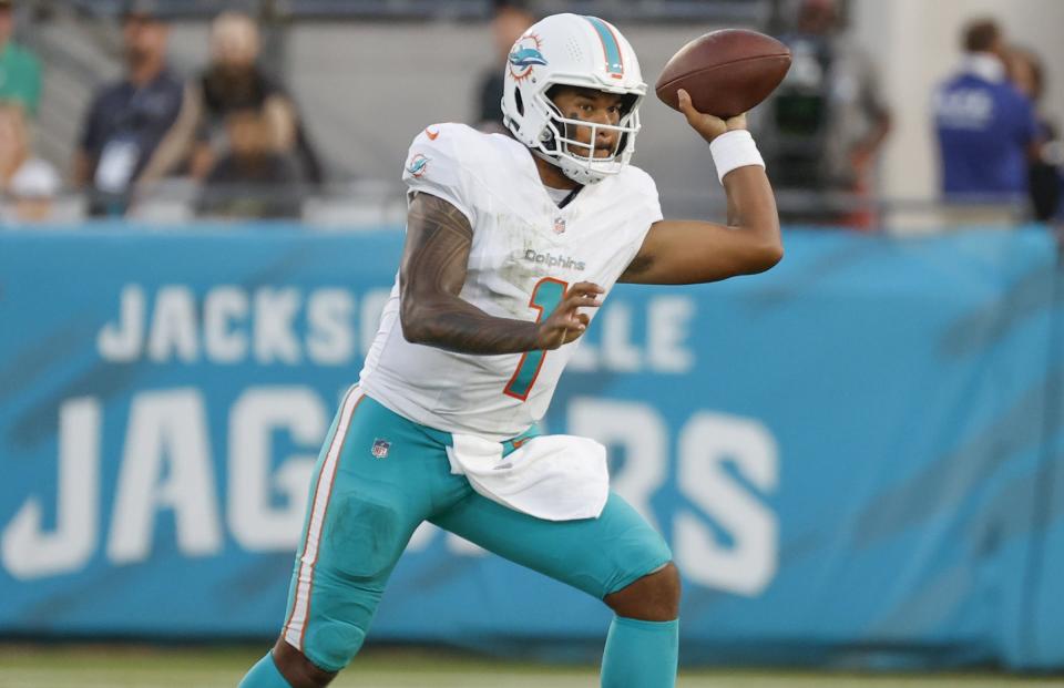 Miami Dolphins quarterback Tua Tagovailoa (1) sets up to pass during the first quarter of the team's preseason NFL football game against the Jacksonville Jaguars Saturday, Aug. 26, 2023, in Jacksonville, Fla. (Al Diaz/Miami Herald via AP)