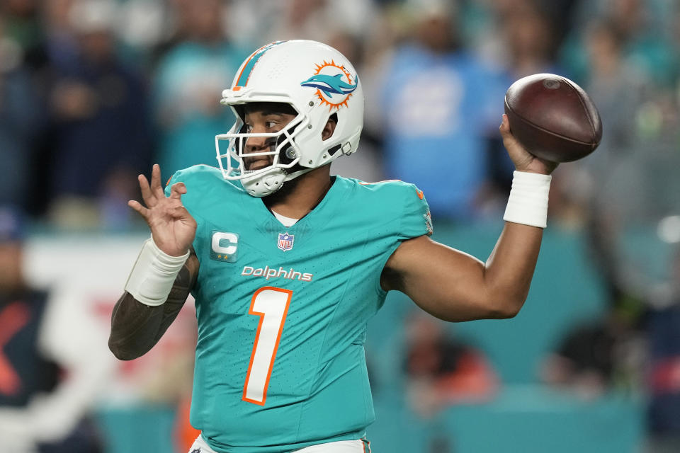 Miami Dolphins quarterback Tua Tagovailoa (1) aims a pass during the first half of an NFL football game against the Tennessee Titans, Monday, Dec. 11, 2023, in Miami, Fla. (AP Photo/Rebecca Blackwell)