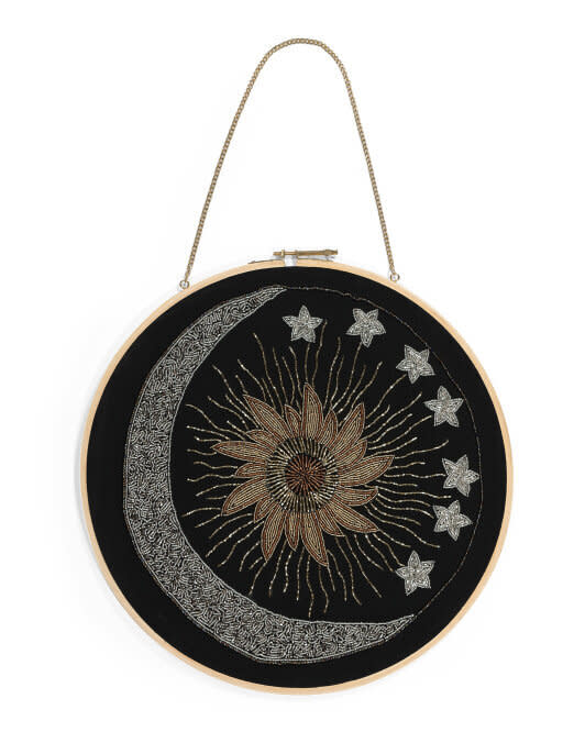 The metallic beads make this wall hanging especially magical and mystical. <a href="https://fave.co/3o5NRdl" target="_blank" rel="noopener noreferrer">Find it for $17 at T.J.Maxx</a>. 