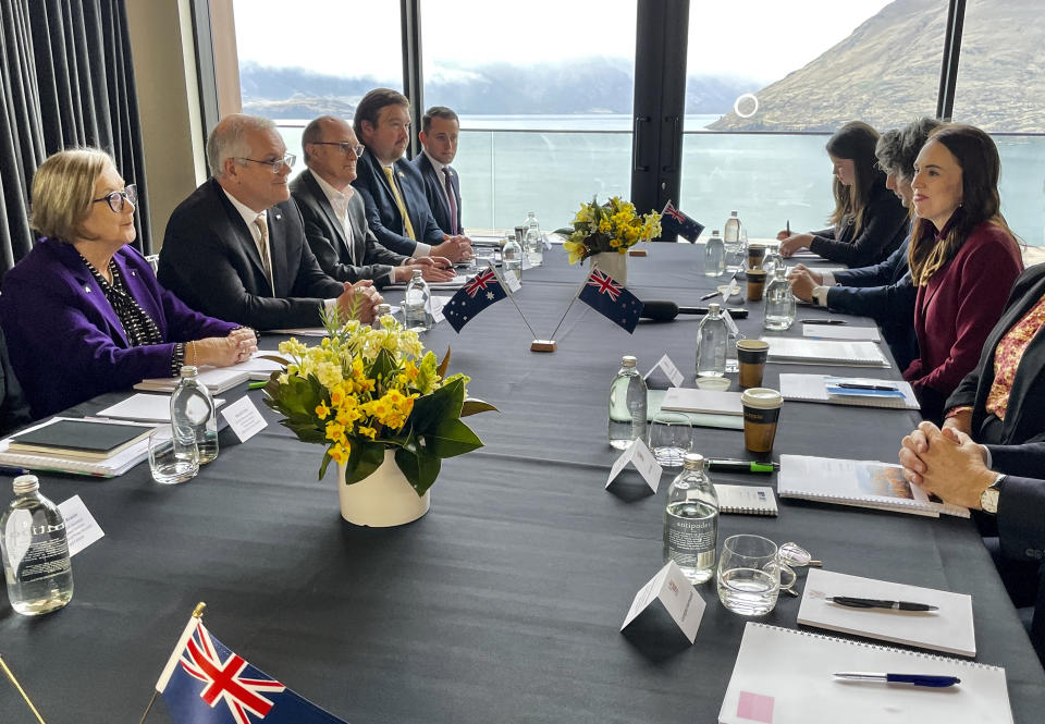 Australian Prime Minister Scott Morrison, second left, talks with New Zealand Prime Minister Jacinda Ardern, right, in Queenstown, New Zealand, Monday, May 31, 2021. (Derek Cheng/NZ Herald via AP)