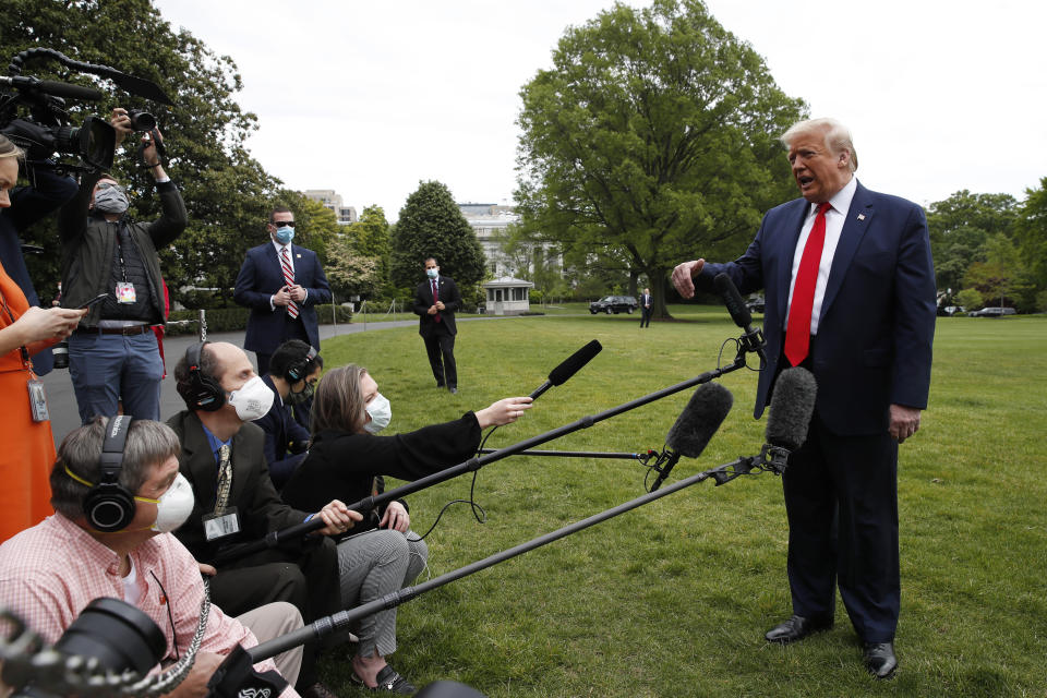 President Donald Trump speaks with reporters on the South Lawn of the White House as he departs on Marine One, Thursday, May 14, 2020, in Washington. Trump is en route to Allentown, Pa. (AP Photo/Alex Brandon)