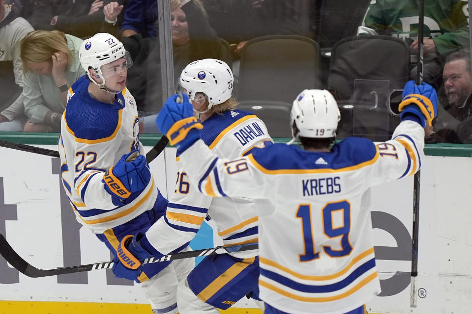 Buffalo Sabres right wing Jack Quinn (22) celebrates goal that was waved off for high sticking with teammates Rasmus Dahlin (26) and Peyton Krebs (19) during the second period an NHL hockey game against the Dallas Stars in Dallas, Tuesday, April 9, 2024. (AP Photo/LM Otero)