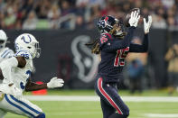 Houston Texans wide receiver Will Fuller (15) pulls in a catch in front of Indianapolis Colts cornerback Pierre Desir (35) during the first half of an NFL football game Thursday, Nov. 21, 2019, in Houston. (AP Photo/David J. Phillip)