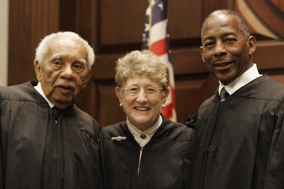 FILE - South Carolina State Supreme Court Chief Justice Jean Toal, center, stands with retired Chief Justice Ernest Finney, left, after administering the oath of office to Justice Don Beatty, right, Wednesday, Sept. 5, 2007, in Columbia, S.C. The South Carolina General Assembly is expected Wednesday to elect a new state Supreme Court justice who who turn the now all-male high court into an all-white court. (AP Photo/Mary Ann Chastain, File)
