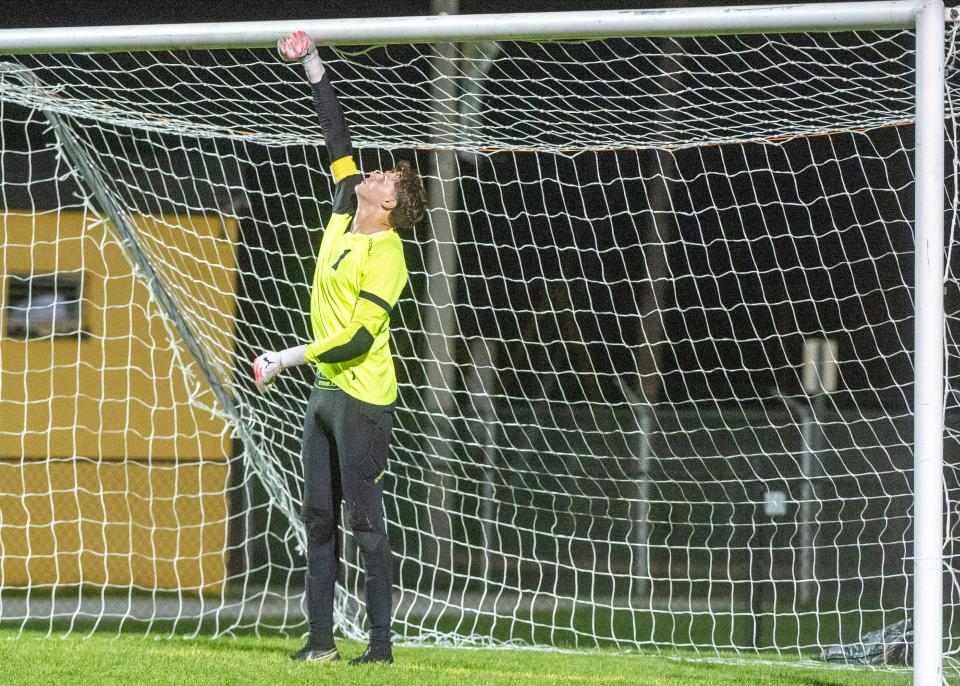 Littlestown's Christopher Meakin taps the top of the goal before Delone Catholic took a penalty kick on Thursday, Oct. 5, 2023.