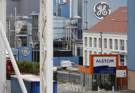 The logos of French power and transport engineering company Alstom and U.S. conglomerate General Electric are pictured on their site in Belfort, June 23, 2014. REUTERS/Vincent Kessler