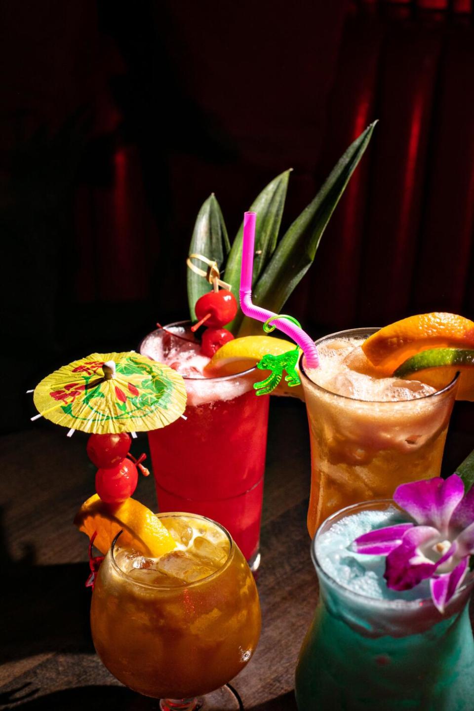 From top left: Singapore Sling, Zombi; from bottom left, Chief Lapu Lapu, Blue Hawaiian tiki drinks at Tiki No bar.