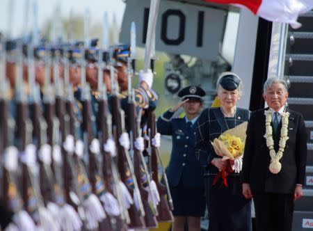 Japanese Emperor Akihito and Empress Michiko review honor guards upon arrival at the Manila International Airport, January 26, 2016. REUTERS/Romeo Ranoco/Files