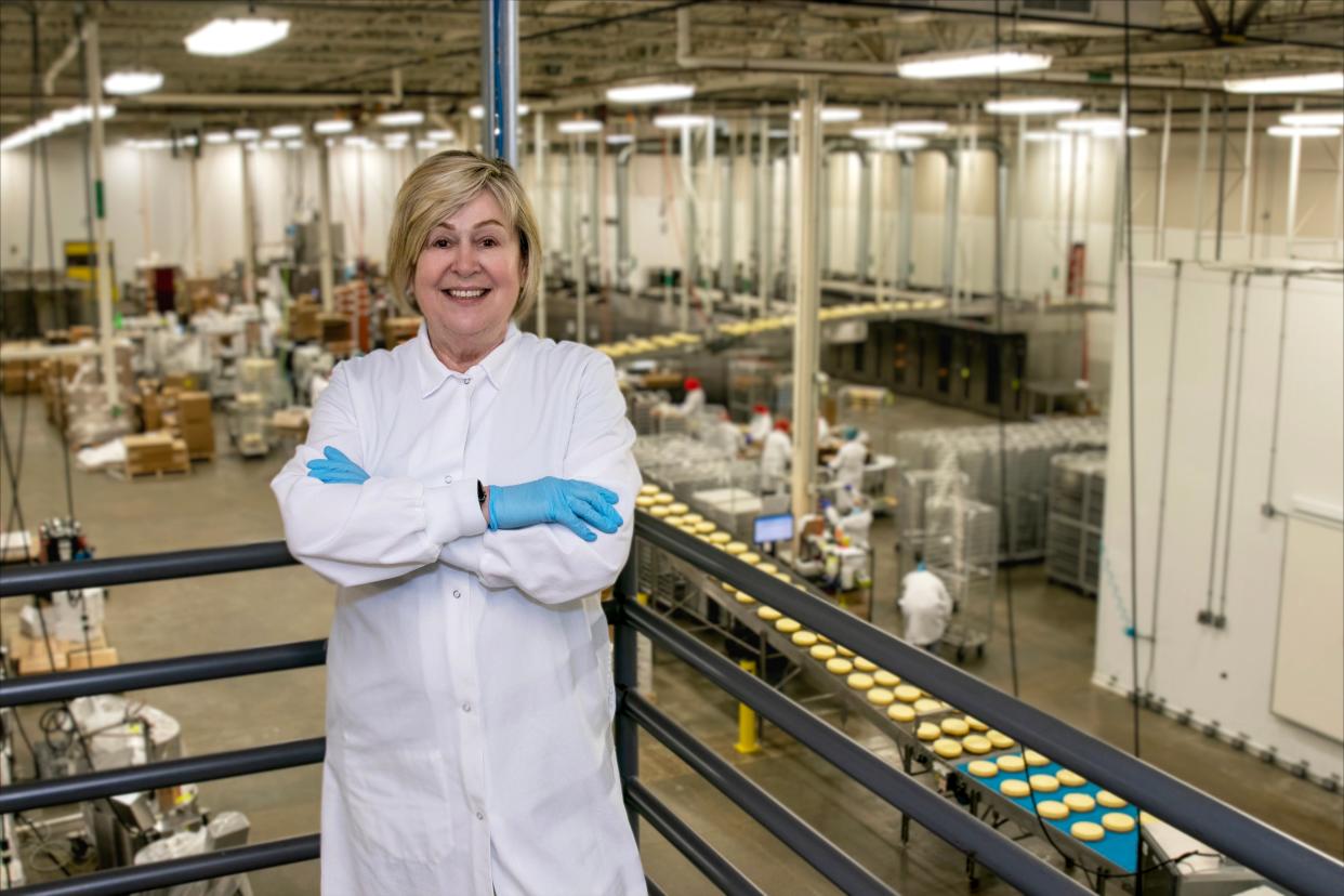 Suzy Strothmann stands on the plant floor of her business, Suzy's Cream Cheesecakes, in Oak Creek.