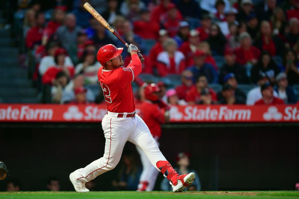 Los Angeles Angels right fielder Hunter Renfroe (12) hits a two run home run against the Los Angeles Dodgers during the third inning of a spring training game on March 28, 2023.