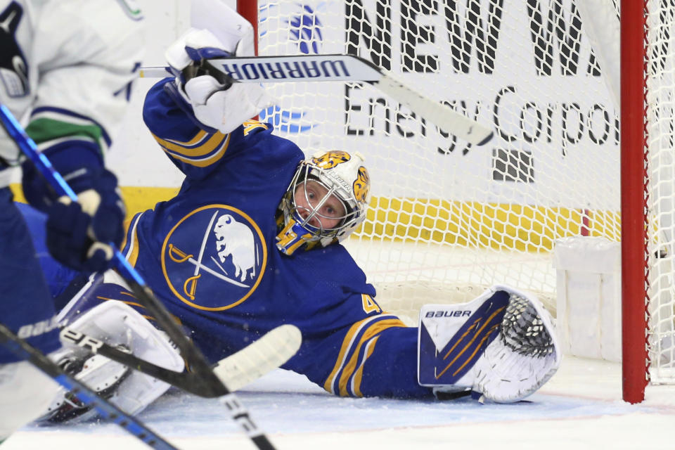 Buffalo Sabres goalie Craig Anderson watches the puck during the second period of the team's NHL hockey game against the Vancouver Canucks, Tuesday, Oct. 19, 2021, in Buffalo, N.Y. (AP Photo/Jeffrey T. Barnes)