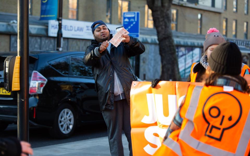 A man burns a leaflet given by JSO activists - Marcin Nowak