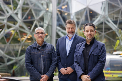 Outside Amazon headquarters in downtown Seattle. From left to right: Rajeev Badyal, vice president of Project Kuiper; Darío Werthein, president of Vrio Corp.; and Panos Panay, senior vice president of Amazon Devices & Services. (Photo: Business Wire)