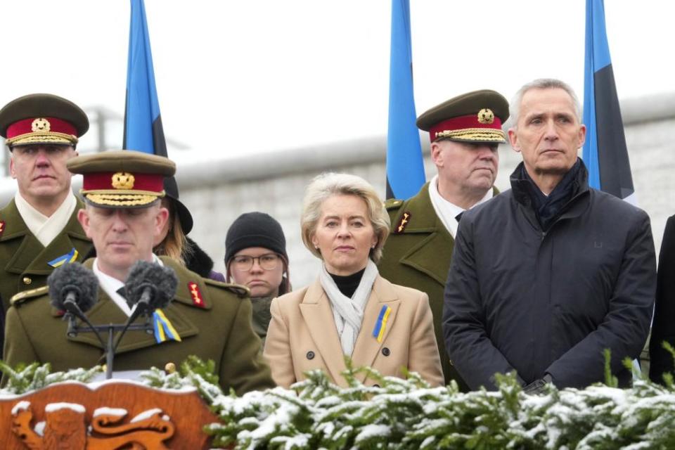 Von der Leyen and the Nato secretary general, Jens Stoltenberg (right), stand during an Independence Day ceremony in Tallinn, Estonia