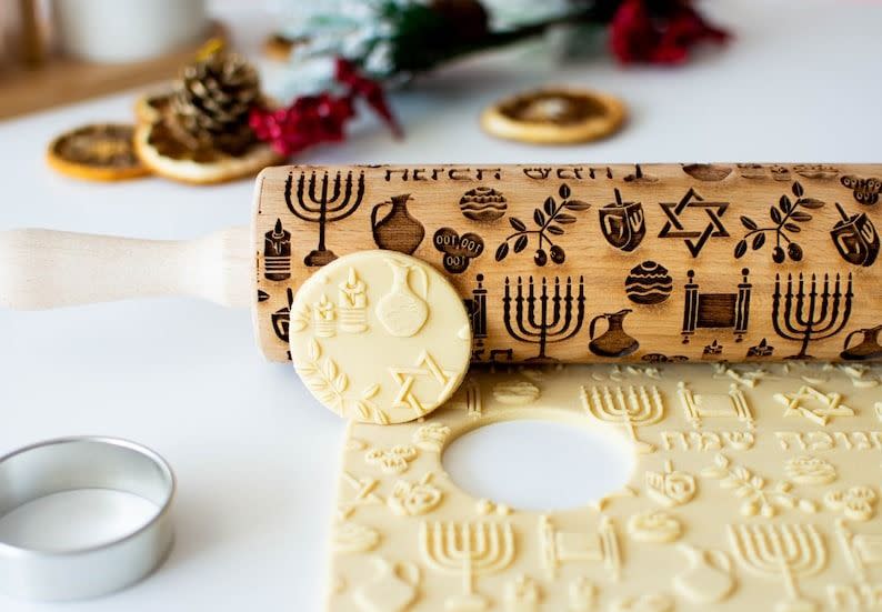 <p><a href="https://go.redirectingat.com?id=74968X1596630&url=https%3A%2F%2Fwww.etsy.com%2Flisting%2F748155475%2Fhappy-hanukkah-embossing-rolling-pin&sref=https%3A%2F%2Fwww.thepioneerwoman.com%2Fholidays-celebrations%2Fgifts%2Fg45825939%2Fhanukkah-gifts%2F" rel="nofollow noopener" target="_blank" data-ylk="slk:Shop Now;elm:context_link;itc:0;sec:content-canvas" class="link ">Shop Now</a></p><p>Happy Hanukkah Embossing Rolling Pin</p><p>etsy.com</p><p>$27.85</p>