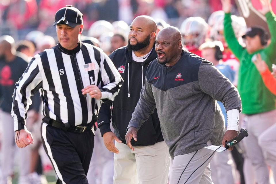 Nov 26, 2022; Columbus, Ohio, USA;  Ohio State Buckeyes defensive line coach Larry Johnson yells from the sideline during the first half of the NCAA football game against the Michigan Wolverines at Ohio Stadium. Mandatory Credit: Adam Cairns-The Columbus Dispatch