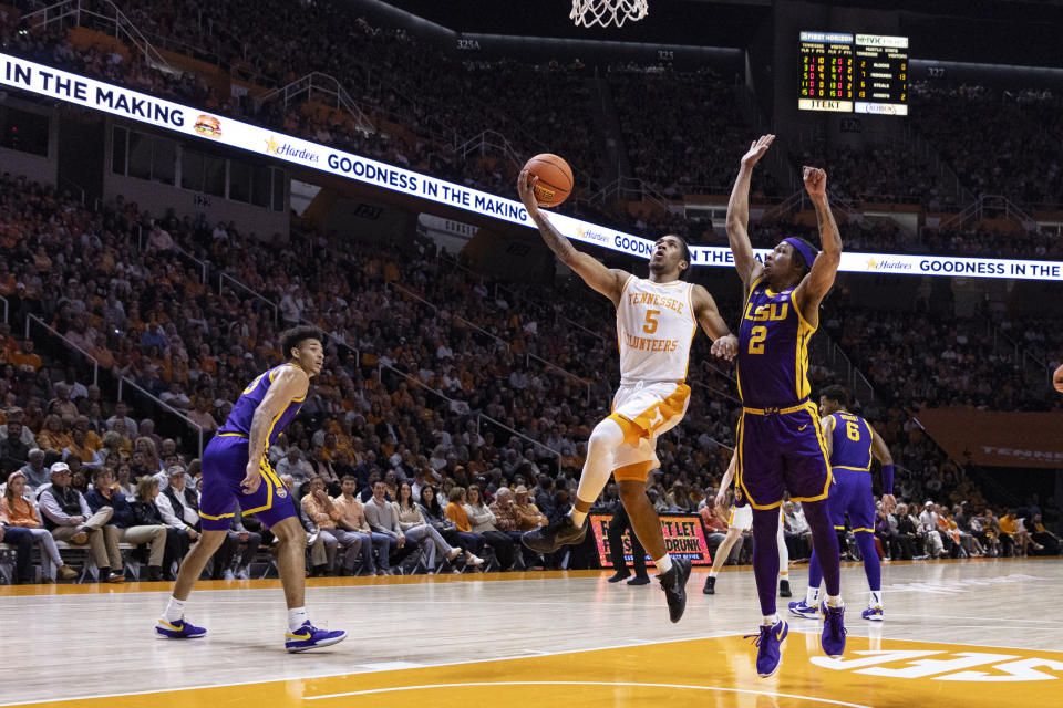 Tennessee guard Zakai Zeigler (5) shoots past LSU guard Mike Williams III (2) during the first half of an NCAA college basketball game Wednesday, Feb. 7, 2024, in Knoxville, Tenn. (AP Photo/Wade Payne)