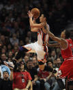 CHICAGO, IL - MARCH 12: Jeremy Lin #17 of the New York Knicks drives past Derrick Rose #1 of the Chicago Bulls at the United Center on March 12, 2012 in Chicago, Illinois. The Bulls defeated the Knicks 104-99. NOTE TO USER: User expressly acknowledges and agrees that, by downloading and or using this photograph, User is consenting to the terms and conditions of the Getty Images License Agreement. (Photo by Jonathan Daniel/Getty Images)