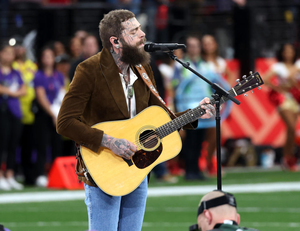 Post Malone sings on the field