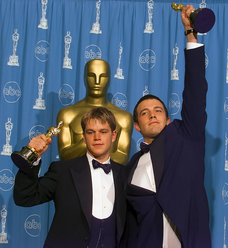 Closeup of Matt and Ben holding their Oscars
