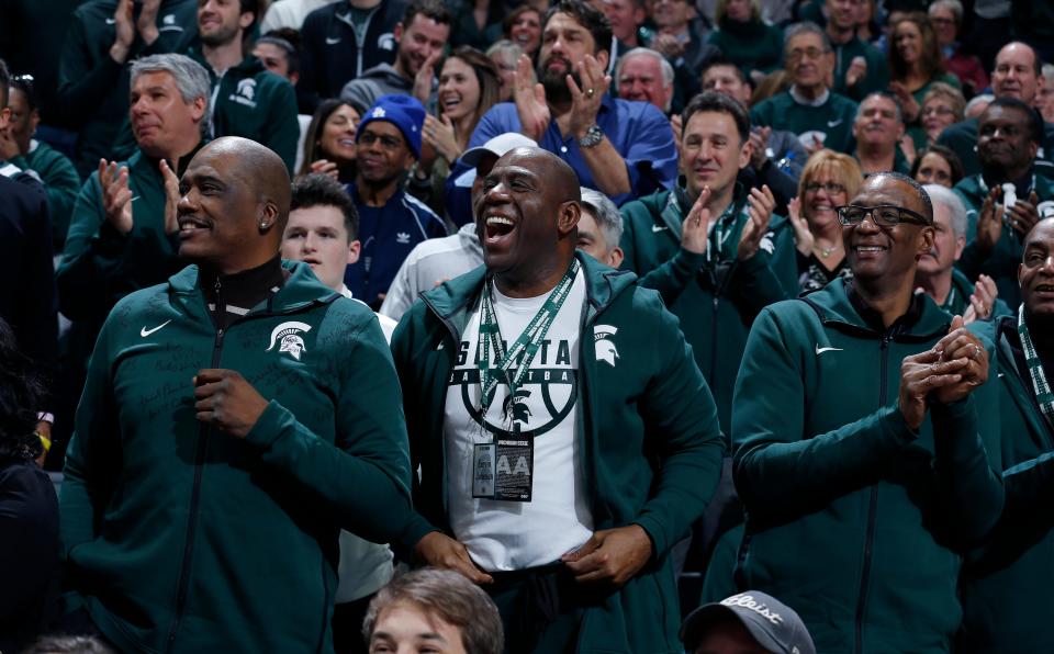 Former players on Michigan State's 1979 national championship team, including Jay Vincent, left, Magic Johnson, center, and Greg Kelser, right, on Saturday, Feb. 9, 2019, in East Lansing.