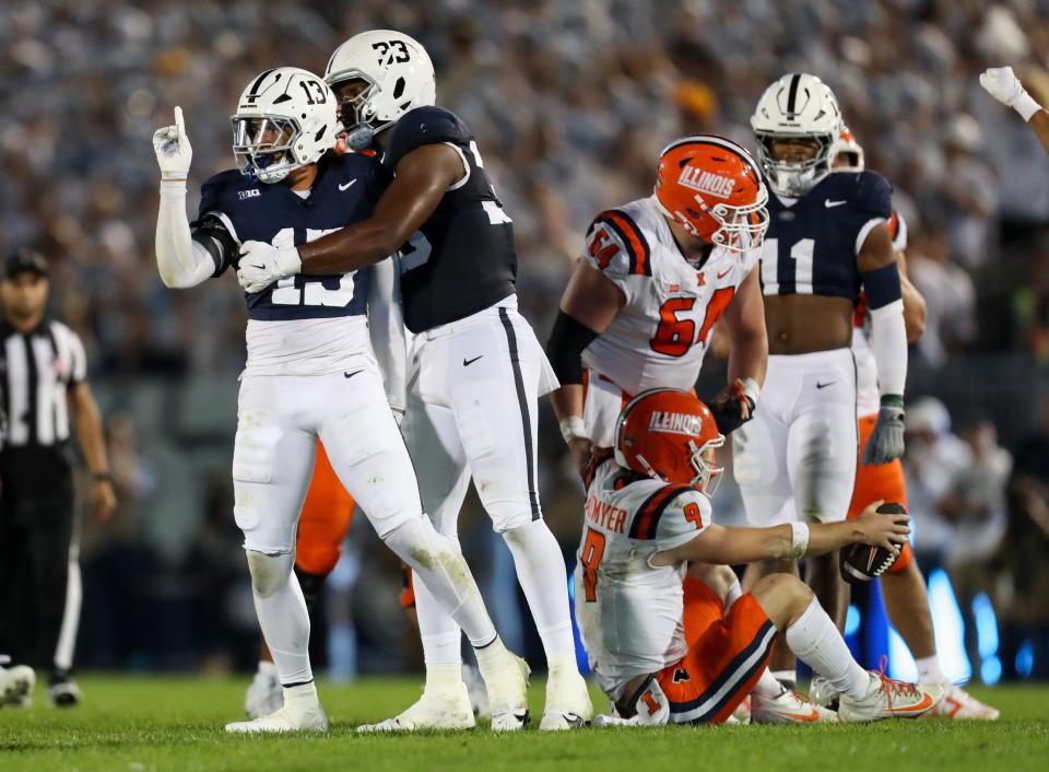 Sep 28, 2024; University Park, Pennsylvania, USA; Penn State Nittany Lions linebacker Tony Rojas (13) reacts after tackling Illinois Fighting Illini quarterback Luke Altmyer (9) on third down during the first quarter at Beaver Stadium.