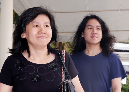 Teen blogger Amos Yee arrives with his mother at the State Courts in Singapore September 28, 2016. REUTERS/Edgar Su