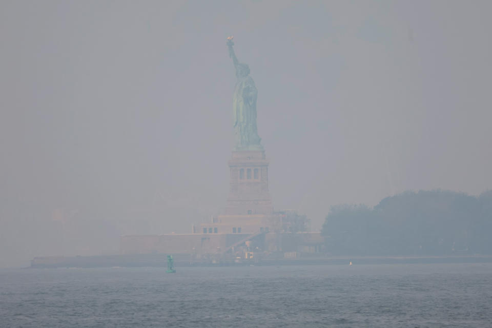 The Statue of Liberty seen through haze June 8, 2023. (Michael M. Santiago / Getty Images)