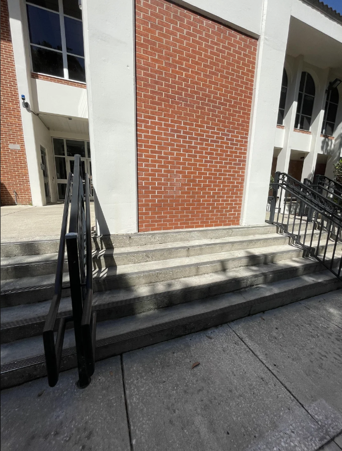 stairs leading up to a brick wall