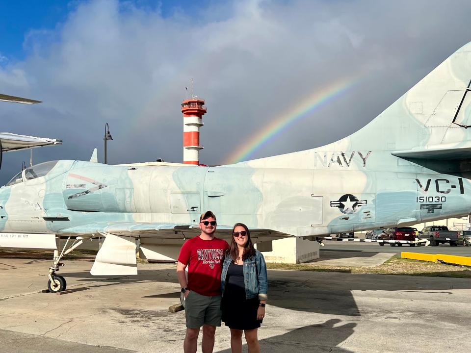 The author and her husband in front of a Navy jet at the aviation museum in Honolulu.