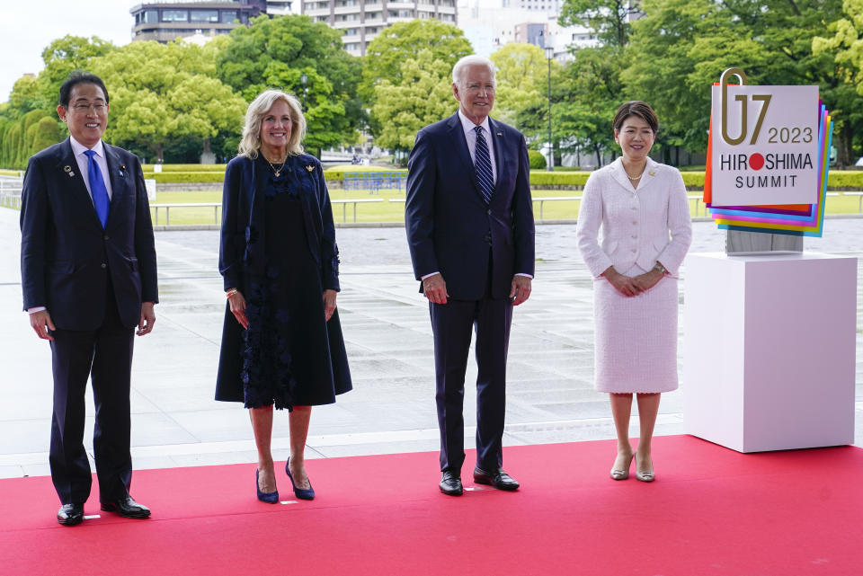 President Joe Biden and first lady Jill Biden pose for a photo with Japan's Prime Minister Fumio Kishida, left, and his wife Yuko Kishida, right, at the Hiroshima Peace Memorial Park in Hiroshima, Japan, Friday, May 19, 2023. Biden is in Hiroshima to attend the G7 Summit. (AP Photo/Susan Walsh,POOL)