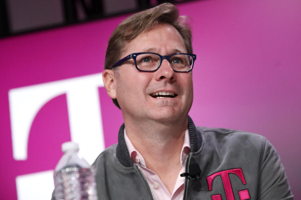 FILE - In this Nov. 7, 2019, file photo, T-Mobile President Mike Sievert answers caller questions during a press conference in New York. T-Mobile says Mike Sievert will become CEO in May, following the end of John Legere’s contract. The company said Monday, Nov. 18, 2019, that the move is part of its succession plan. Legere will remain with the company as a board member. (Brian Ach/AP Images for T-Mobile, File)