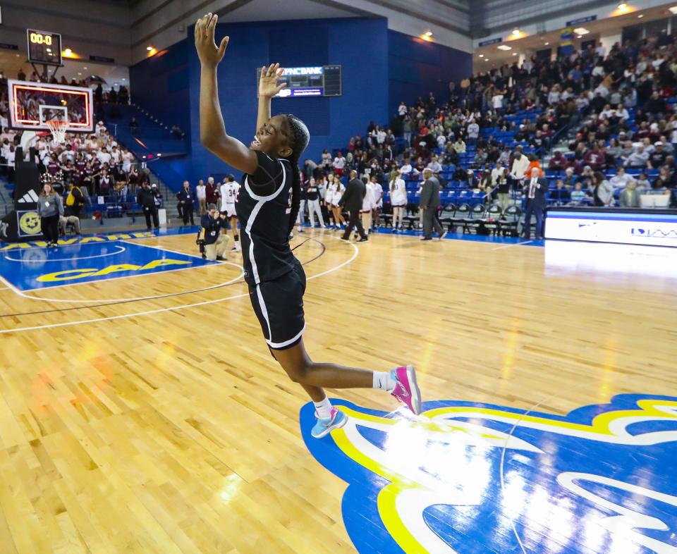 Ursuline's Jezelle "GG" Banks celebrates after leading the Raiders with 29 points in their 49-48 win over Caravel in the DIAA championship at the Bob Carpenter Center, Saturday, March 9, 2024.