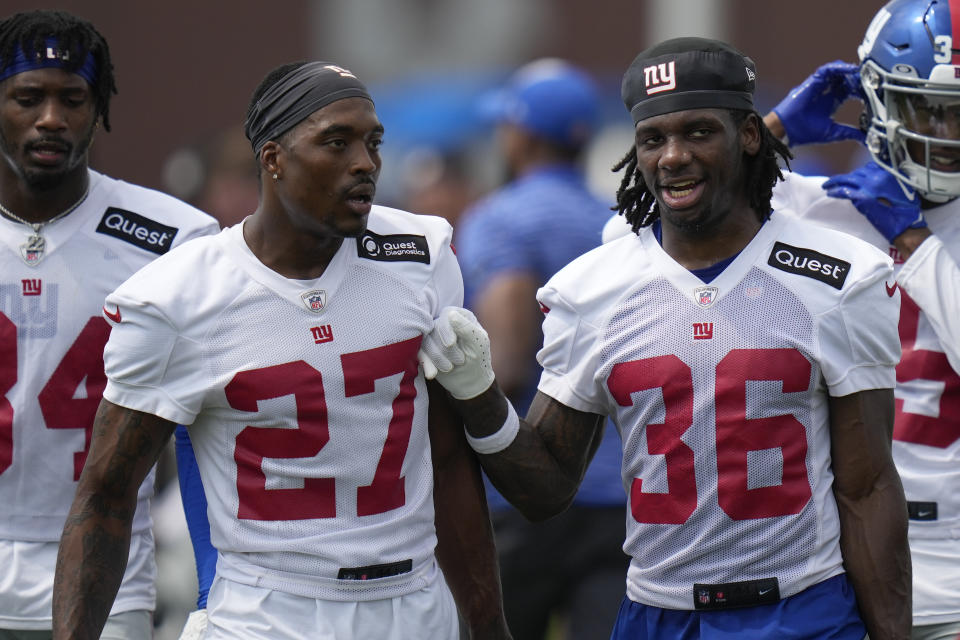 New York Giants' Deonte Banks, right, talks with Jason Pinnock (27) at the NFL football team's training facility in East Rutherford, N.J., Thursday, July 27, 2023. (AP Photo/Seth Wenig)