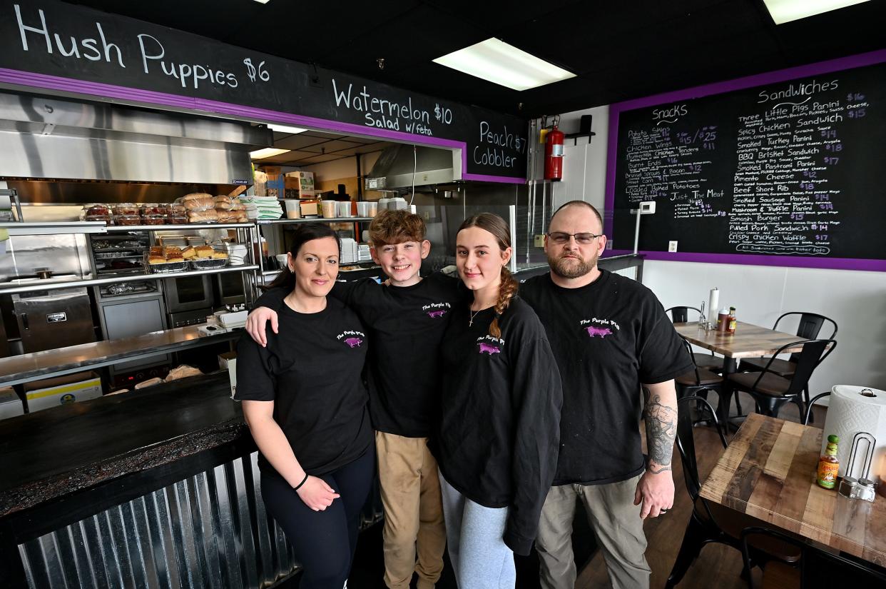 Mike and Ejona Winslett ― shown here with their children Mikaela, 14, and Mason, 13 ― are the owners of the recently opened Purple Pig Takeout & Catering in Marlborough.