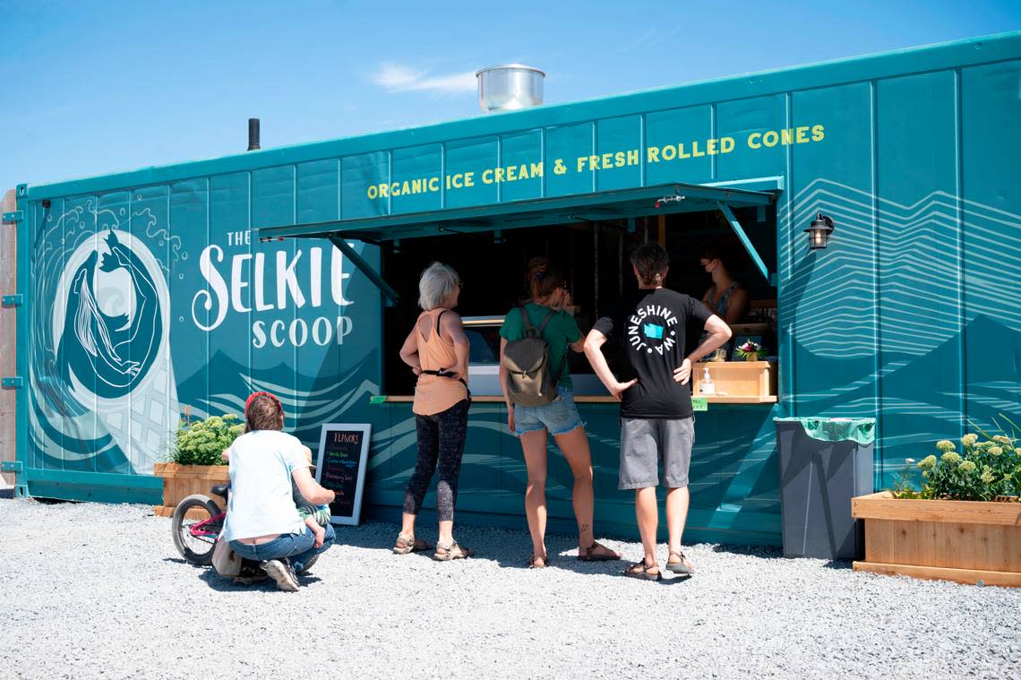 People stop for a treat at The Selkie Scoop near Kulshan’s Trackside Beer Garden on the waterfront on Thursday, Aug. 5, 2021, in Bellingham, Wash. The seasonal business plans to be at the site through October. Warren Sterling/The Bellingham Herald