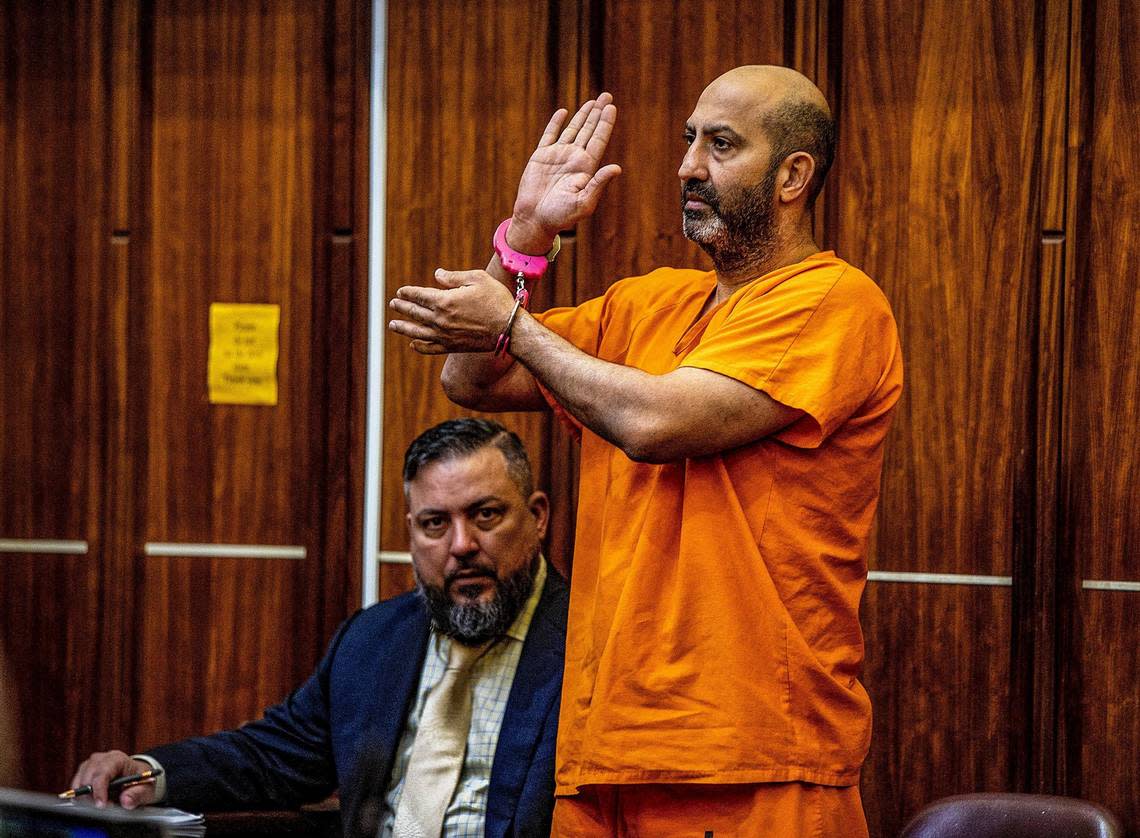 Defense attorney Stephan Lopez seats next to client Ali Amin Saleh, as he takes the oath during the fifth day of his bail hearing in front of Judge Robert T. Watson. He is accused of witness tampering in the case of two Hialeah police officers who are accused of kidnapping a homeless man, driving him to an isolated location, and beating him while he was handcuffed and leaving him behind unconscious. The hearing took place at the at the Richard E. Gerstein Justice Building, in Miami, on Friday February 10, 2023.