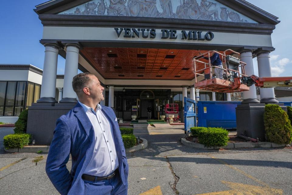 Monte Ferris Jr. checks out the work being done to the main entrance of the Venue de Milo. Ferris is renovating and remodeling the event space.