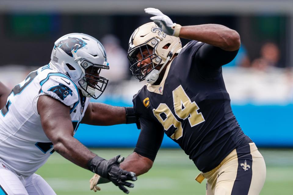 New Orleans Saints defensive end Cameron Jordan, right, battles Carolina Panthers offensive tackle Taylor Moton during the second half of an NFL football game Sunday, Sept. 19, 2021, in Charlotte, N.C.