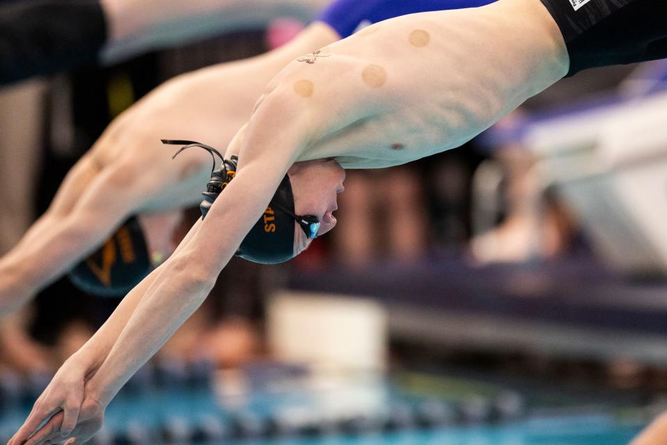 A Skyridge High School swimmer competes in the Men’s Free Relay at the Utah 6A State Meet at the Stephen L. Richards Building in Provo on Saturday, Feb. 24, 2024. | Marielle Scott, Deseret News