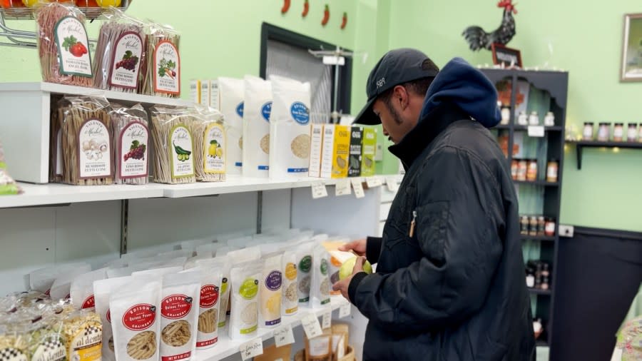 One customer browsed through the granola shelf looking at the many options for sale.