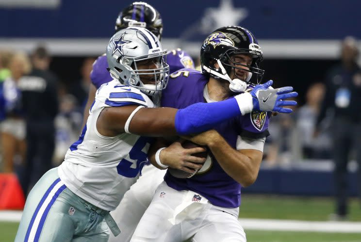 Cowboys lineman David Irving sacks Ravens quarterback Joe Flacco last season. (AP)