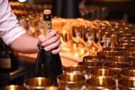 <p>The drinks keep flowing throughout the show, and there's no shortage of champagne. A few years back, it was reported that there were <a href="https://www.eonline.com/news/611279/there-will-be-how-many-roses-at-the-golden-globes" rel="nofollow noopener" target="_blank" data-ylk="slk:400 bottles;elm:context_link;itc:0;sec:content-canvas" class="link ">400 bottles</a> of Moët & Chandon on hand to keep guests' glasses filled while at their tables.</p>