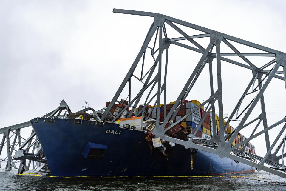 Wreckage of the Francis Scott Key Bridge rests on the container ship Dali, Wednesday, April 3, 2024, in Baltimore. (AP Photo/Julia Nikhinson)