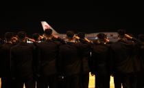 <p>North Koreans salute as an Air China jumbo jet carries leader Kim Jong-un shakes from Changi Airport on June 12, 2018, in Singapore. (Photo: Ministry of Communications and Information Singapore via Getty Images) </p>