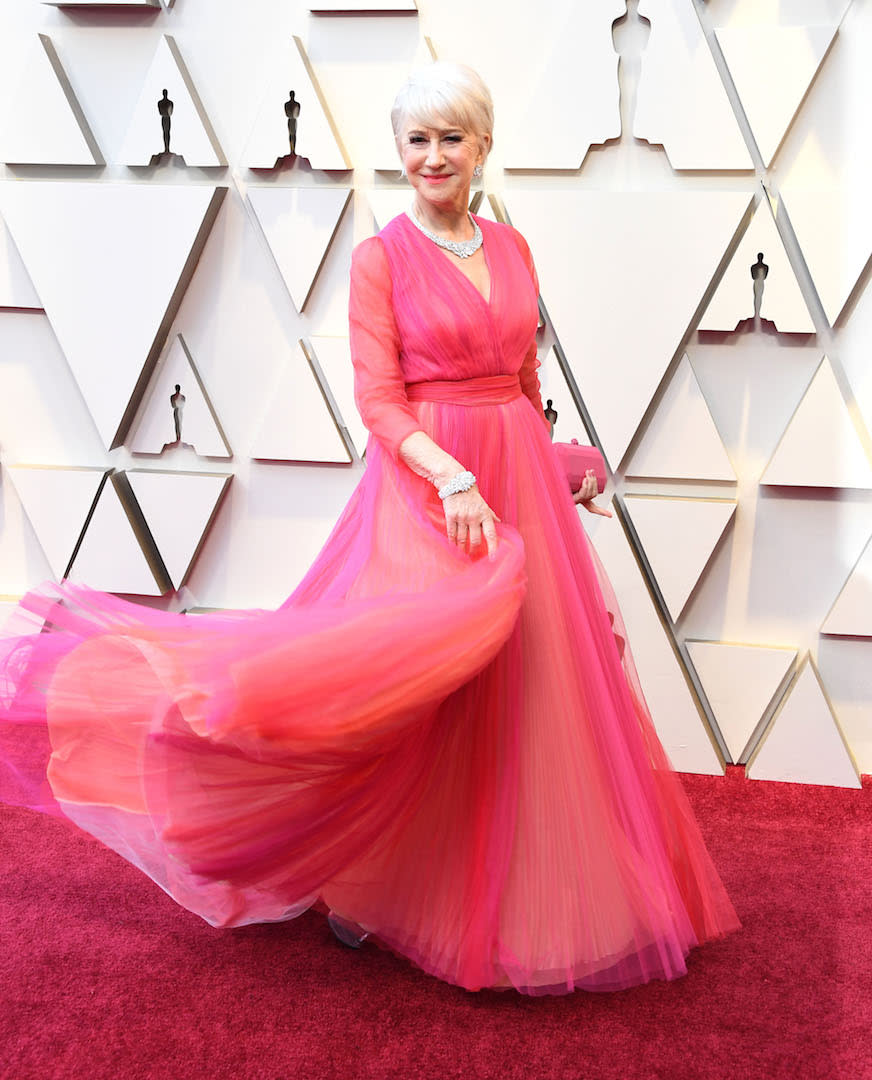 Helen Mirren's greatest look to date is undoubtedly the frothy tulle frock by Schiaparelli she wore to the 2019 Oscars. Though her bold choice comes as no surprise to her legion of fashion followers, as the 74-year-old recently dyed her hair millennial pink for the 2019 Cannes Film Festival. <em>[Photo: Getty]</em>